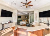 Thumbnail 12 of 19 - a kitchen with a counter top and a tv