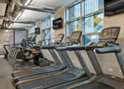 Thumbnail 15 of 31 - cardio equipment in the gym at the monarch club apartments