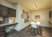 Thumbnail 9 of 39 - a dining room with a white table and chairs