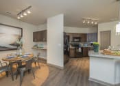 Thumbnail 1 of 39 - Spacious Dining Room with Work Area and View into Large Open Kitchen | Apartments in Nashville | 909 Flats