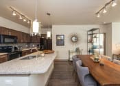 Thumbnail 13 of 39 - Elegant Kitchen with Large Island and Bar Seating | Apartments in Nashville | 909 Flats