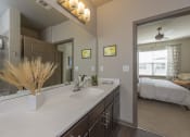 Thumbnail 17 of 39 - a bathroom with a large mirror and a sink