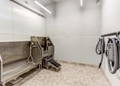 Thumbnail 23 of 34 - A cleaning machine is on the left and a vacuum cleaner is on the right in a clean room.