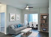 Thumbnail 25 of 30 - A living room with a grey couch and a ceiling fan.