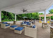 Thumbnail 14 of 30 - A patio with a white roof and a ceiling fan.
