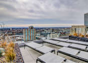 Thumbnail 18 of 18 - A rooftop with a view of the cityscape.