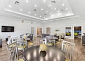 Thumbnail 17 of 23 - A modern dining room with a large table and chairs.