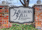 Thumbnail 19 of 19 - A sign that says "Hallburn Halls Information Center" is mounted on a brick wall.