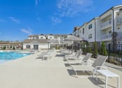 Thumbnail 2 of 20 - our apartments have a large pool and lounge chairs