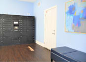 Thumbnail 6 of 36 - A room with a large black cabinet and a white door.