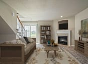 Thumbnail 3 of 47 - Two-Bedroom Townhomes in Peculiar, MO - Bradley’s Crossing - Living Room with Carpet Flooring, Long Couch, Coffee Table, Media Console, Large Painting, Fireplace, Mounted TV, and a Bookshelf.