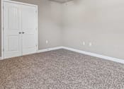 Thumbnail 8 of 23 - A room with a ceiling fan and a door.