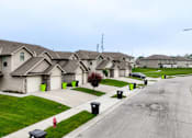 Thumbnail 1 of 23 - A row of houses with a red fire hydrant in front of the first house.