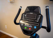 Thumbnail 16 of 28 - A black exercise bike with the word "SPORT" on the front.