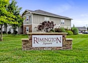 Thumbnail 28 of 28 - A sign for Remington Square with a house in the background.