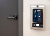 Thumbnail 21 of 79 - A door with a lock and a card reader on the wall.