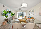 Thumbnail 32 of 41 - A modern dining room with a glass table and white chairs.