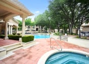 Thumbnail 31 of 36 - a swimming pool with a spa in front of a resort style pool