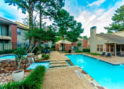Thumbnail 13 of 18 - Exterior View of Property Featuring Sparkling Swimming Pool with Heated Jacuzzi and Beautiful Fountains