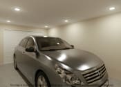 Thumbnail 24 of 25 - a silver car parked in a garage