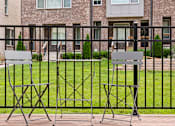 Thumbnail 144 of 149 - Two chairs and a table are set up on a patio.