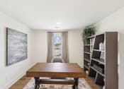 Thumbnail 14 of 25 - a dining room with a large wooden table and a window
