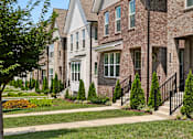Thumbnail 141 of 149 - A row of houses with a tree in front of the first one.