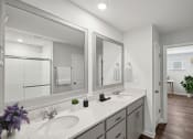Thumbnail 7 of 25 - a white bathroom with two sinks and mirrors