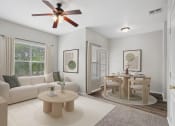 Thumbnail 1 of 25 - a living room and dining room with a couch and a table