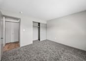 Thumbnail 33 of 35 - A room with a grey carpet and white walls.