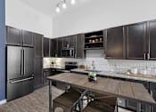 Thumbnail 49 of 66 - Luxury Apartments in Germantown Nashville TN - Peyton Stakes - Kitchen with Stainless Steel Appliances, and Granite Counters.