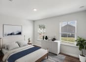 Thumbnail 8 of 25 - a bedroom with a bed and two windows