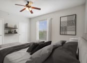 Thumbnail 5 of 25 - a bedroom with a large bed and a ceiling fan