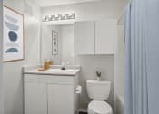 Thumbnail 8 of 25 - a bathroom with a sink toilet and a shower