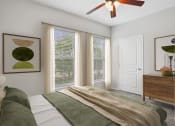 Thumbnail 6 of 25 - a bedroom with a bed and a ceiling fan