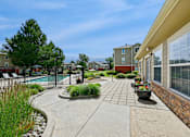Thumbnail 12 of 25 - A residential area with a pool and a fence.