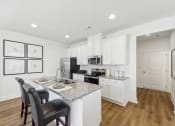 Thumbnail 2 of 25 - spacious stainless steel appliance kitchen