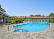 Thumbnail 2 of 35 - A small pool surrounded by a brick patio.