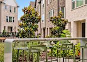 Thumbnail 142 of 149 - A row of green chairs are lined up on a concrete bench.