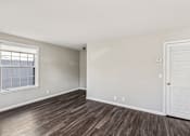 Thumbnail 5 of 15 - A room with a white door and a window with blinds.