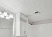 Thumbnail 10 of 11 - A white bathroom with a sink, toilet, and bathtub.