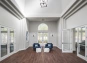 Thumbnail 2 of 32 - a living room with furniture and a large window