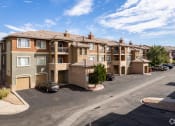 Thumbnail 29 of 32 - an aerial view of an apartment complex with cars parked in a parking lot