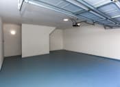 Thumbnail 17 of 36 - A room with a blue floor and white walls.