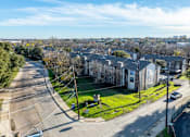 Thumbnail 18 of 21 - A residential area with houses and a street.