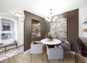 Thumbnail 22 of 34 - a dining room with a table and chairs