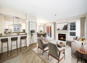 Thumbnail 1 of 34 - Seattle, WA Luxury Apartments- Union Bay- Living Room and Fireplace with Sectional Couch and Tan Area Rug