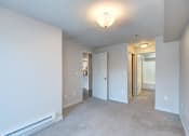 Thumbnail 18 of 34 - an empty room with a carpeted floor