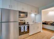 Thumbnail 1 of 24 - kitchen with stainless steel appliances, microwave, range