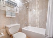 Thumbnail 5 of 24 - bathroom with tub and tile surround